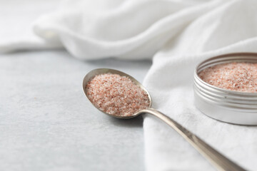 Closeup of Pink Himalayan Salt on Spoon with Neutral  Background with Copy Space