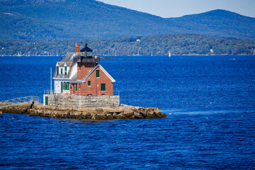 ROCKLAND Breakwater Lighthouse surrounded by dozens of lobster traps.tif