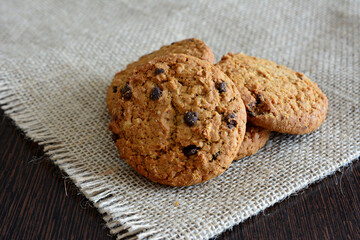 chocolate chip cookies on a table with burlap napkin 