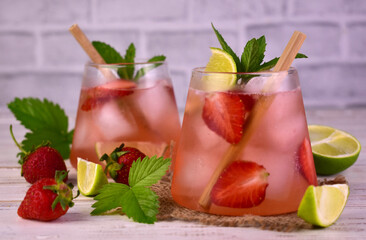 Mojito with strawberries and lime. A refreshing drink.
