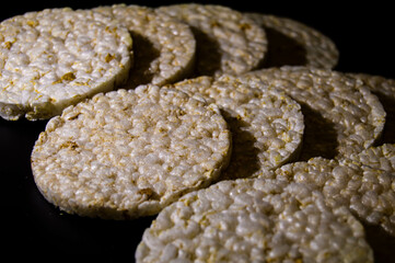 corn crisps prepared to be eaten on a black background by an athlete or a person trying to lose weight with shades