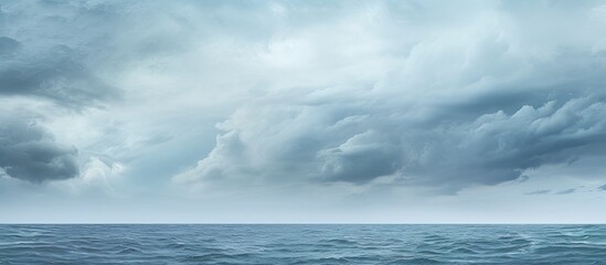 Obraz premium Cloudy storm clouds looming above the Atlantic Ocean with copy space image available.