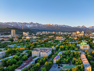 View from a quadcopter of the central part of the Kazakh city of Almaty on a spring morning against the backdrop of a mountain range