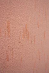 Abstract background in pastel color with rustic cement texture.Raindrops falling