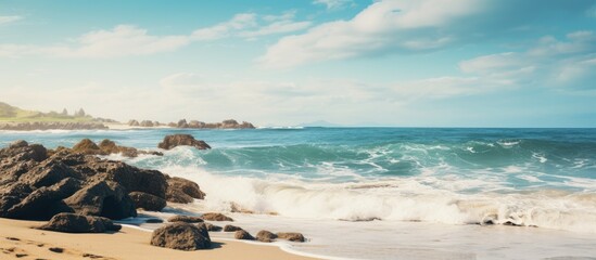 Obraz premium Beach scenery with rocks and waves captured in the copy space image.