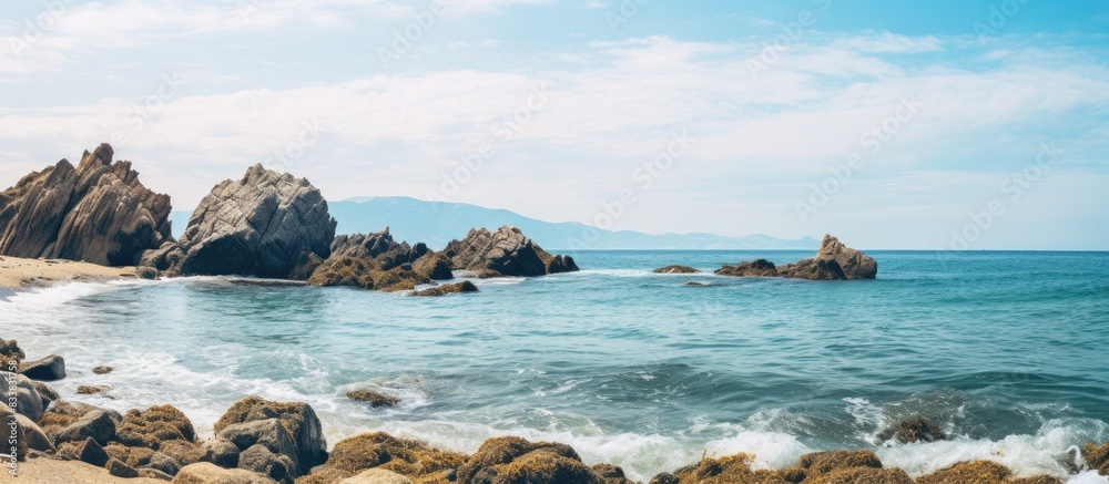 Aufkleber beautiful coastal rocks by the beach with a captivating view and copy space image.