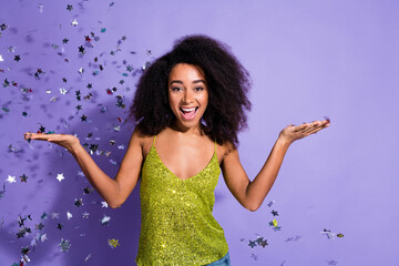Photo portrait of gorgeous young girl dancing discotheque confetti wear trendy green sequins outfit isolated on purple color background