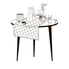 table with an orchid in a pot and a pot of soil, a package of soil for indoor plants