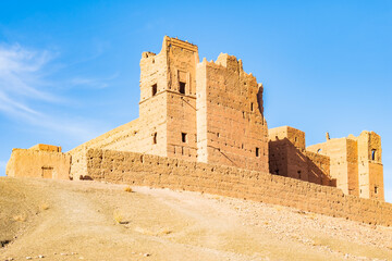 View of old ancient Tamnougalt kasbah castle in Atlas Mountains, Morocco, North Africa