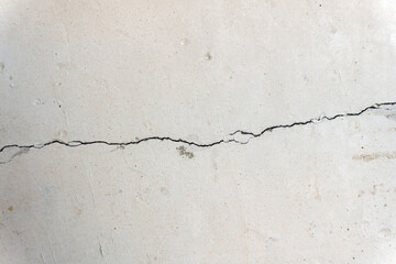 Cracked concrete cement wall in an industrial building, great for your design and background texture