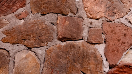 Old Wall Stone Texture in Vintage Style .Old Heritage castle natural red stone wall Building with rough texture background, Ancient  Grunge brick wall with concrete