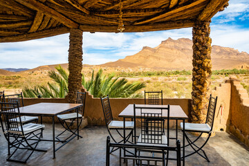 Restaurant terrace in luxury lodge hotel near Agdz town with view of Jebel Kissane mountain in...