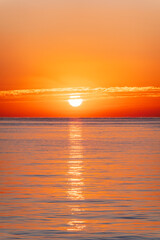 Fototapeta premium Beautiful red and orange sunrise over the sea.