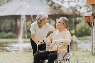 Elderly couple. Asian elderly couple giving love to each other smiling happily. Love and care for each other.
