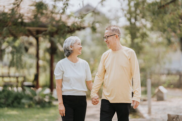 Obraz premium Elderly couple. Asian elderly couple giving love to each other smiling happily. Love and care for each other.