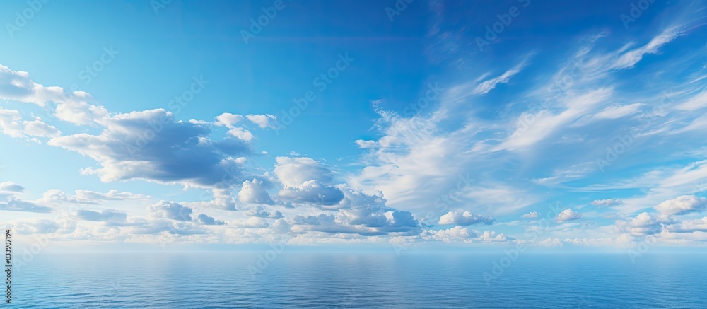 Poster Scenic sky with fluffy clouds above the ocean with copy space image.