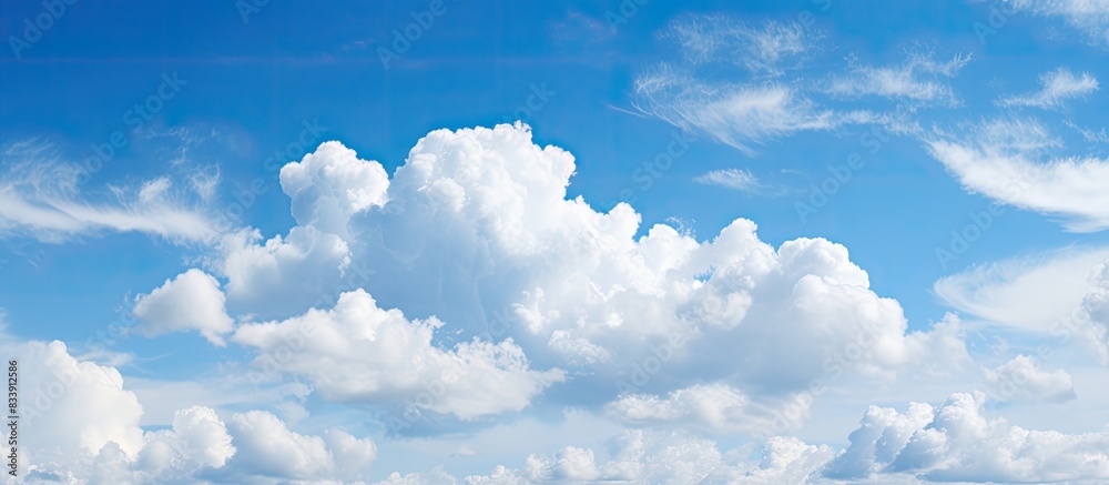 Aufkleber the expansive blue sky with fluffy clouds provides a serene background for copy space image.