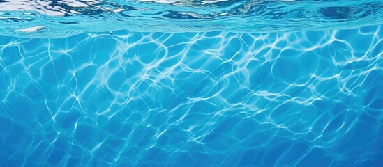 Detailed view of a blue swimming pool water, showing rippling patterns, perfect as a copy space image.
