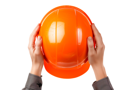 A man's hands hold a builder's helmet on a white or transparent background. Close-up of a builder's hands holding an orange helmet. Graphic design element on the theme of construction.