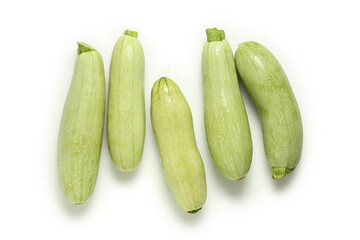 top view of raw zucchinis on white