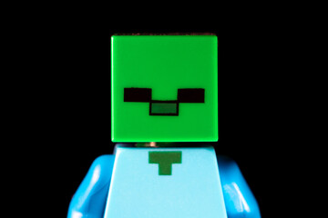 Naklejka premium Face of LEGO Minecraft Zombie mob with green square face