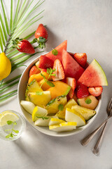 Summer fruits assortment platter antipasti, watermelon, pineapple, melon and strawberries. 
