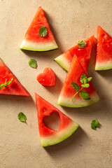 Fresh slices of watermelon over warm neutral background. Summer abstract texture.