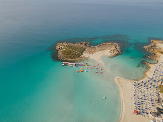 Aerial view of Nissi beach island bathing in the early morning golden sun. Calm turquoise...