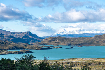 Panoramic view over Nordenskjöld Lake in central sector W-trek hiking route in Torres del Paine National Park, Patagonia, Chile surrounded by mountains of the Paine Massif 