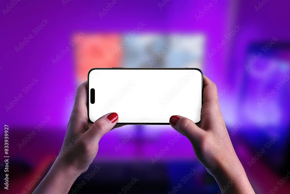 Poster hands engaged in gameplay on a smartphone, emphasizing an isolated screen for mockup purposes. ideal
