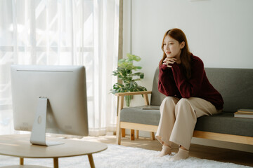 Fototapeta premium The happiness of an entrepreneur, a beautiful Asian business woman For online shopping, enjoy social media and laptop at