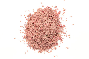 A Pile of Dried Red Raspberry Seeds Isolated on a White Background