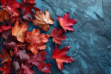 Autumn background with colored red leaves on a blue slate background. Top view, copy space, AI-Generated, 