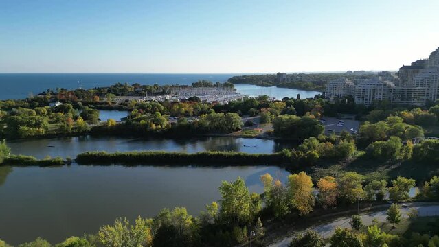 Aerial drone footage of Humber Bay park in Etobicoke Ontario Canada on a sunny day with blue sky