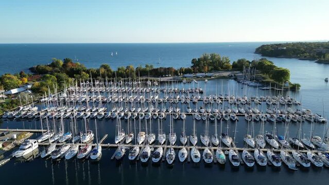 Aerial drone footage of marina sail boats in Humber Bay Etobicoke Toronto on a sunny day with blue sky. Lake Ontario