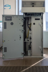 modern cash acceptance and payment terminal with an open front door ready for service