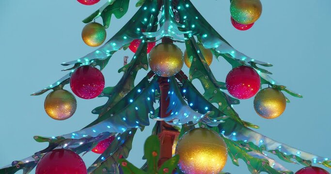 Artificial christmas tree with toys and flashing lights. Cinema 4K 60fps one minute video