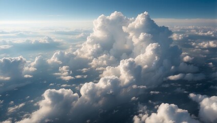 Large white soft clouds on a blue sky, view from above.