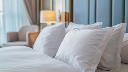 Fototapeta premium white pillowcases on a plush bed in luxurious bedroom