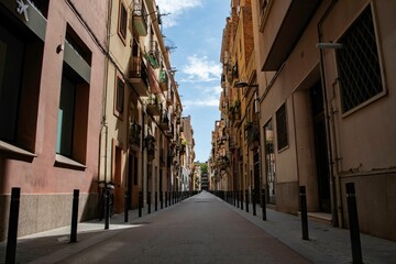 old and narrow street in the Spain city of Barcelona