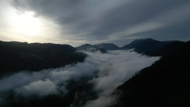 Aerial View Of Idrijca valley from Vrata Cepovan - Beautiful Morning Mist Clouds over River and Towns Connected with Local Road - Slovenia