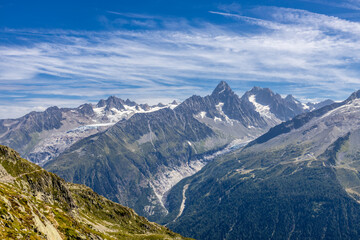 Chamonix Montblanc beautiful alpine mountain summits landscape. Alps mountains with snow and glacier above green valley of Chamonix in France. Alps beautiful scenery in summer