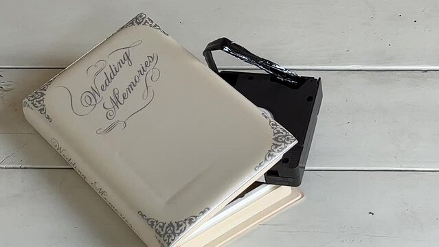 Wedding Memories VHS cassette with ripped tape symbolizing gray divorce