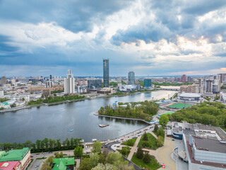 Yekaterinburg city with Buildings of Regional Government and Parliament, Dramatic Theatre, Iset Tower, Yeltsin Center, panoramic view at summer sunset.