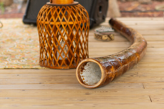 Traditional sound therapy instruments on wooden surface