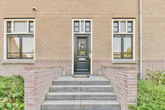 Classic home entrance with decorative door and windows