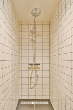 Modern shower with white tiles and sleek design