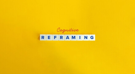 Cognitive Reframing aka Cognitive Restructuring Term and Banner. Cursive Font and Text on Block Letter Tiles on Yellow Background. Minimalist Aesthetics.