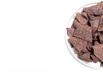 Top View Mockup Isolated Organic Blue Corn Tortilla Chips On Half Plate, White Background. Healthy Crunchy Snack Seasoned With Sea Salt. Design Horizontal Plane. Copy Space.