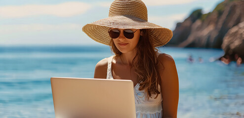 Woman on summer vacation on the beach using her laptop - concept of vacation work, remote work, searching for ideas, financial freedom 